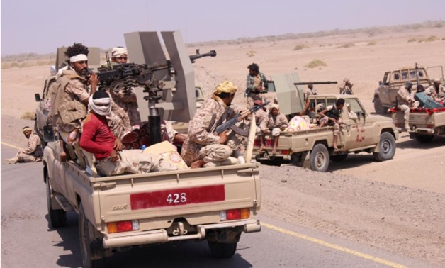 Members of the Yemeni army ride on the back of military trucks near the Red Sea coast city of al-Mokha, Yemen January 23, 2017 - REUTERS/Fawaz Salman