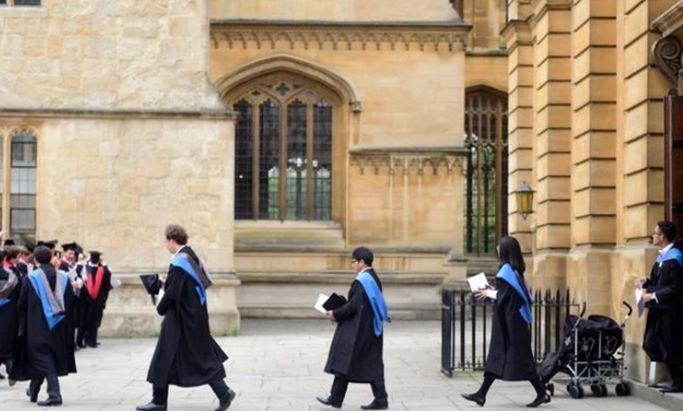 Graduates leave the Sheldonian Theatre after a graduation ceremony at Oxford University, in Oxford, Britain July 15, 2017. REUTERS/Hannah McKay