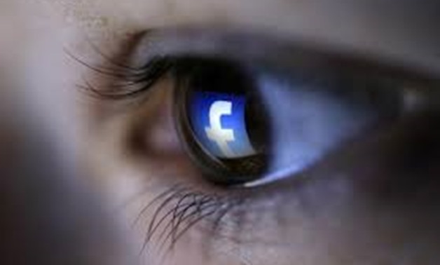 A picture illustration shows a Facebook logo reflected in a person's eye, in Zenica, March 13, 2015. REUTERS/Dado Ruvic
