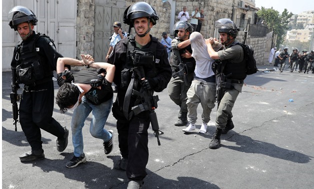 Israeli security forces arrest Palestinian men following clashes outside Jerusalem's Old city July 21, 2017. REUTERS/Ammar Awad
