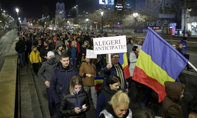 People march in protest against the ruling Social Democrats' plans to overhaul judicial legislation in Bucharest, Romania, November 5, 2017. Inquam Photos/Octav Ganea/via REUTERS