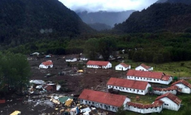 © RESCATE CHAITEN/AFP | This handout photo released by Rescate Chaiten shows part of the town of Villa Santa Lucia near Chaiten in southern Chile that was devastated by a landslide that left five dead and 15 missing on December 16, 2017, after flooding de