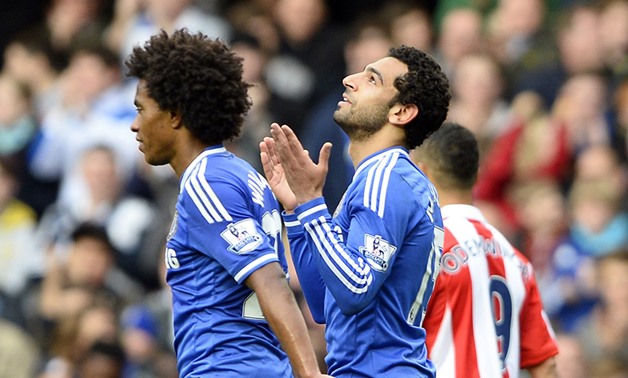 Chelsea's Mohamed Salah (R) celebrates after scoring a goal against Stoke City during their English Premier League soccer match at Stamford Bridge in London April 5, 2014 (Photo: Reuters)
