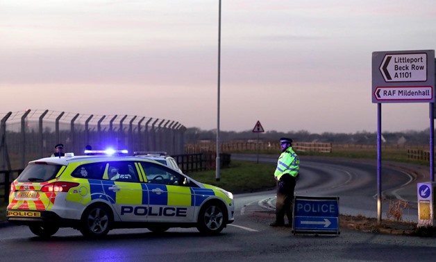 British police stand guard at the entrance to the US Air Force base at RAF Mildenhall, Suffolk, Britain December 18, 2017. REUTERS/Chris Radburn