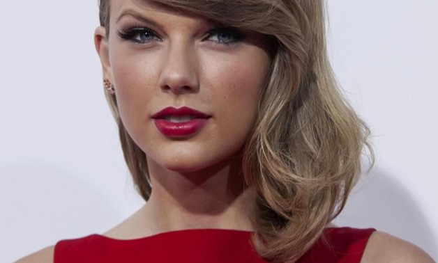 Taylor Swift attends the premiere of "The Giver" in New York, August 11, 2014 – REUTERS/Eric Thayer