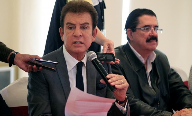 Salvador Nasralla, presidential candidate for the Opposition Alliance Against the Dictatorship, speaks during a news conference with former Honduran president Manuel Zelaya after a meeting with electoral observers of the Organization of American States (O