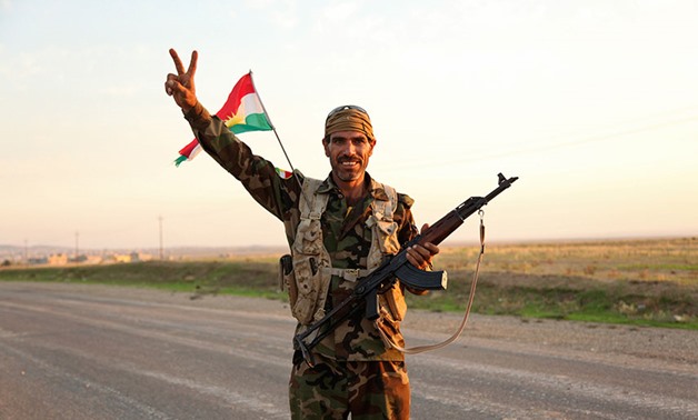 VICTORY: A member of the Kurdish peshmerga just after the forces retook Zumar in October 2014. REUTERS/Ari Jalal

