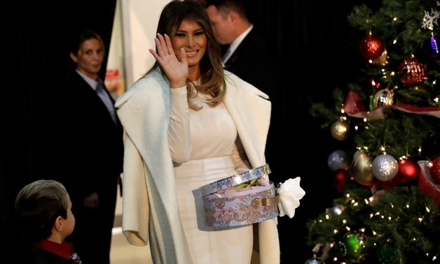 U.S. first lady Melania Trump waves during her annual Christmas visit to Children's National Hospital in Washington, U.S., December 7, 2017. REUTERS/Yuri Gripas