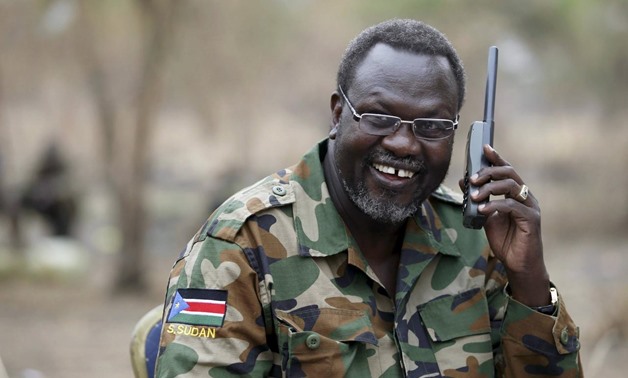 South Sudan's rebel leader Riek Machar talks on the phone in his field office in a rebel-controlled territory in Jonglei State, South Sudan, February 1, 2014. REUTERS/Goran Tomasevic