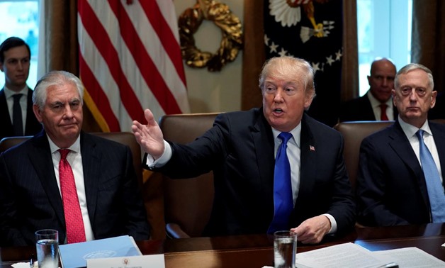 U.S. President Donald Trump excuses reporters after his remarks to them at the start of a cabinet meeting at the White House in Washington, U.S., December 20, 2017. REUTERS/Jonathan Erns
