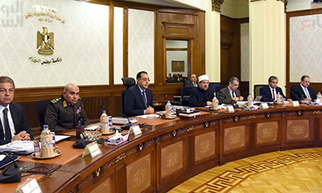 File- Ministers partake in a Cabinet meeting - Press Photo