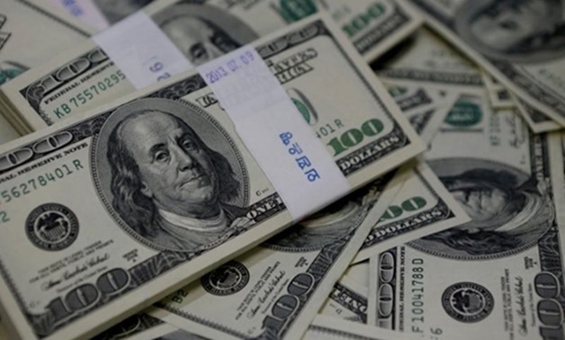 An image showing one-hundred U.S. dollar bills, August 2, 2013 – REUTERS/Kim Hong-Ji/Illustration