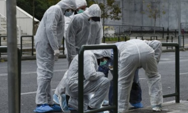 © AFP | Greek police experts searched for evidence after a bomb blast at the Court of Appeal in Athens at 0125 GMT
