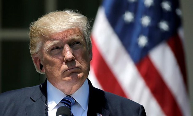 U.S. President Donald Trump listens as South Korean President Moon Jae-in delivers a statement from the Rose Garden after meetings at the White House - Reuters