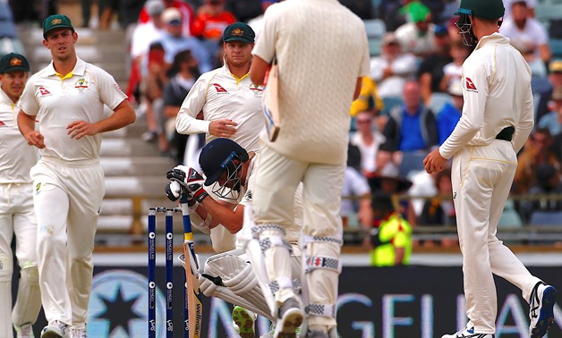 Cricket - Ashes test match - Australia v England - WACA Ground, Perth, Australia, December 18, 2017. England's James Anderson reacts after being hit in the helmet during the fifth day of the third Ashes cricket test match. Picture taken December 18, 2017 
