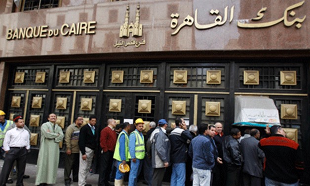 Photo of people standing in the line to make withdrawals outside Banque Du Caire in downtown Cairo-Reuters