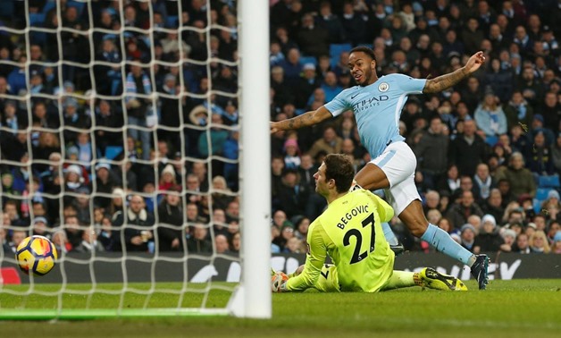 Soccer Football - Premier League - Manchester City vs AFC Bournemouth - Etihad Stadium, Manchester, Britain - December 23, 2017 Manchester City's Raheem Sterling scores their second goal past Bournemouth's Asmir Begovic