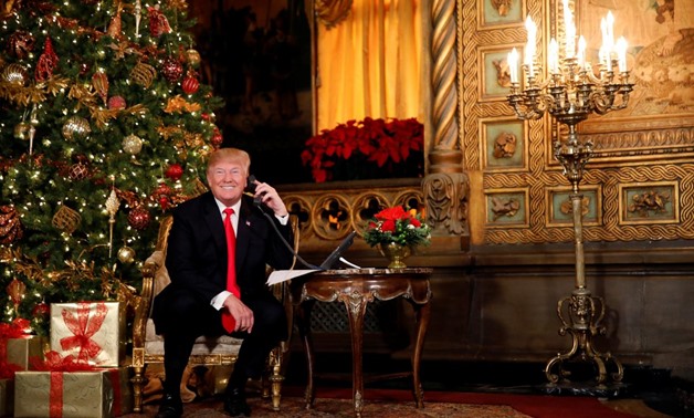 U.S. President Donald Trump participates in NORAD (North American Aerospace Defense Command) Santa Tracker phone calls with children at Mar-a-Lago estate in Palm Beach, Florida, U.S., December 24, 2017. REUTERS/Carlos Barria