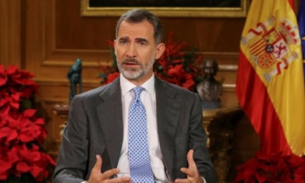 © POOL/AFP / by Serene ASSIR | Spain's King Felipe VI delivers his Christmas Eve message at the Royal Palace in Madrid on December 24, 2017, where he urged Catalan lawmakers to avoid a confrontation over independence
