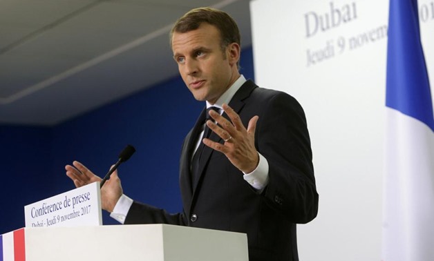 French President Emmanuel Macron gestures during a news conference in Dubai, UAE, November 9, 2017. REUTERS/Satish Kumar