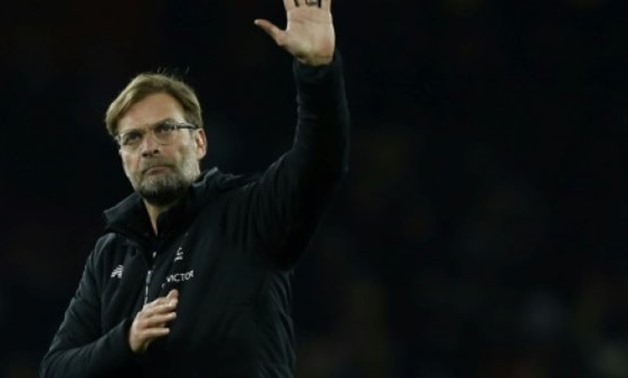 © AFP/File / by Timothy Abraham | Liverpool manager Jurgen Klopp has acknowledged ahead of Liverpool's clash with bottom side Swansea that a Premier League title challenge is beyond them