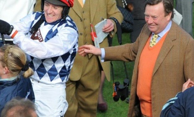 © AFP/File | Trainer Nicky Henderson (R) describes Might Bite, favourite in the King George VI Chase, as "one of the best-looking horses" he's ever set eyes upon