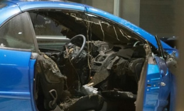 © AFP | The burnt out interior of the car in the lobby of the German Social Democratic Party (SPD) headquarters