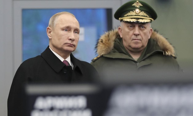 Russian President Vladimir Putin (L) visits the Military Academy of the Strategic Missile Forces, named after Peter the Great, outside Moscow, Russia December 22, 2017. Sputnik/Mikhail Klimentyev/Sputnik via REUTERS