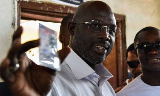 Weah in the running: Former international Liberian football star George Weah will go head-to-head with Joseph Boakai for the Liberian presidency - AFP Photo/ISSOUF SANOGO