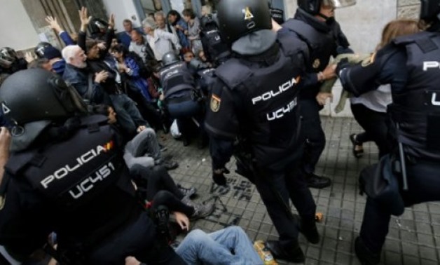 © AFP | Shocking scenes of riot police using batons and rubber bullets to remove people from polling stations on October 1, the day of the referendum that was banned by the courts made headlines around the world and fuelled tensions in Catalonia.
