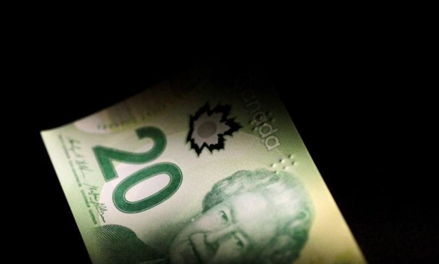 A Canada Dollar note is seen in this June 22, 2017 illustration photo - REUTERS/Thomas White/Illustration