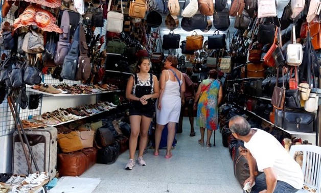 Russian tourists are seen shopping at the old medina in Sousse, Tunisia, September 30, 2017 - REUTERS/Zoubeir Souissi