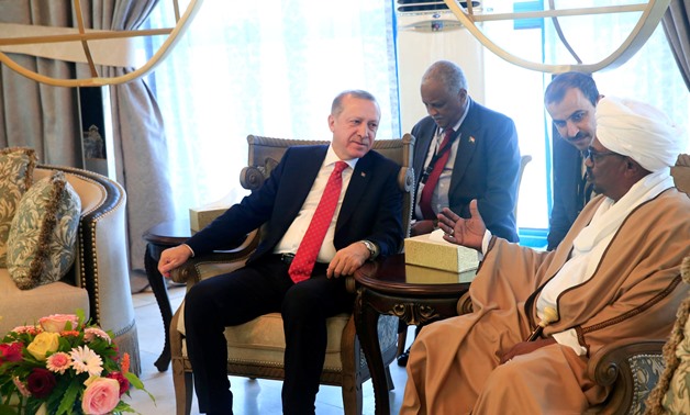 Sudan’s President Omer Al Bashir welcomes Turkey's President Recep Tayyip Erdogan at Khartoum Airport, Sudan December 24, 2017. — Reuters