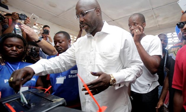 George Weah, former soccer player and presidential candidate of Congress for Democratic Change (CDC), votes at a polling station in Monrovia, Liberia, October 10, 2017. REUTERS/Thierry Gouegnon