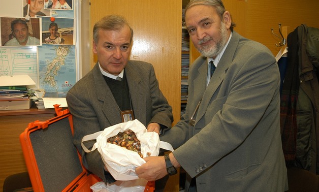 Dr. Yousry Abushady, IAEA Unit Head responsible for safeguards implementation in the DPRK, and an IAEA inspector show broken IAEA safeguards seals salvaged from North Korea. (Vienna, Austria, 3 Jan 2003). - Flickr/IAEA Imagebank