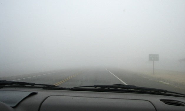 View of a foggy street from the windscreen of a vehicle –Flickr/Emdot 