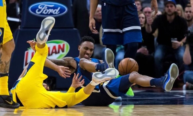 Minnesota Timberwolves guard Jeff Teague (0) tries to get the loose ball in the fourth quarter against the Denver Nuggets at Target Center. Mandatory Credit: Brad Rempel - USA TODAY Sports