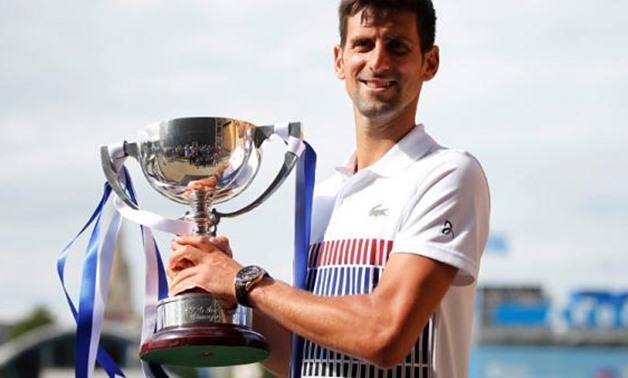 Tennis - ATP World Tour - Aegon International - Eastbourne, Britain - July 1, 2017 Serbia's Novak Djokovic celebrates with the trophy after winning the final against France's Gael Monfils Action Images via Reuters/Matthew Childs