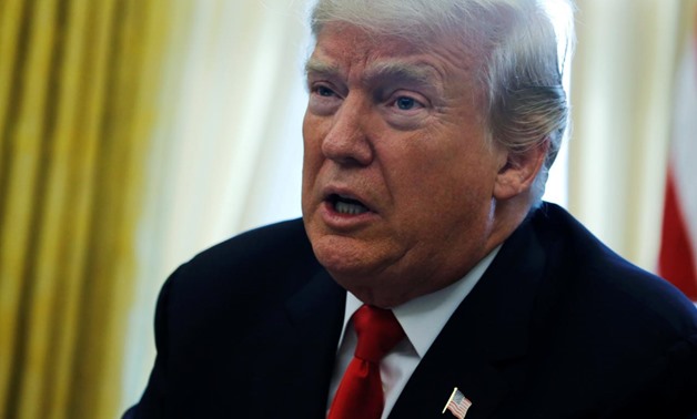 FILE PHOTO - U.S. President Donald Trump delivers remarks after signing sweeping tax overhaul legislation into law in the Oval Office at the White House in Washington, U.S. December 22, 2017. REUTERS/Jonathan Ernst