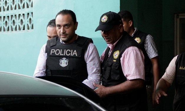 FILE PHOTO: Former governor of Mexico's Quintana Roo state Roberto Borge (C) is escorted by policemen while leaving a court of appeals in Panama City, Panama, June 6, 2017. REUTERS/Carlos Lemos