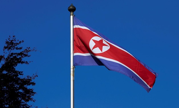 FILE PHOTO - A North Korean flag flies on a mast at the Permanent Mission of North Korea in Geneva October 2, 2014. REUTERS/Denis Balibouse
