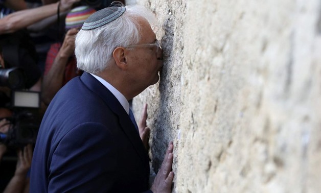 David Friedman, new United States Ambassador to Israel, kisses the Western Wall after arriving- Reuters 