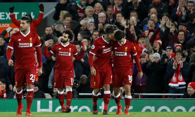 Soccer Football - Premier League - Liverpool vs Leicester City - Anfield, Liverpool, Britain - December 30, 2017 Liverpool's Mohamed Salah celebrates with team mates after scoring their second goal Action Images via Reuters/Carl Recine 