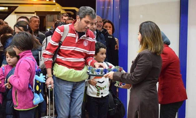 Foreign passengers are handed out Christmas gifts at Marsa Alam airport - Photo courtesy: Ahmed Rabie 