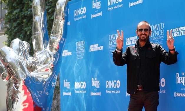 FILE PHOTO: Musician Ringo Starr poses during a "Peace & Love" event to celebrate Starr's 77th birthday in Los Angeles, California, U.S., July 7, 2017. REUTERS/Mario Anzuoni