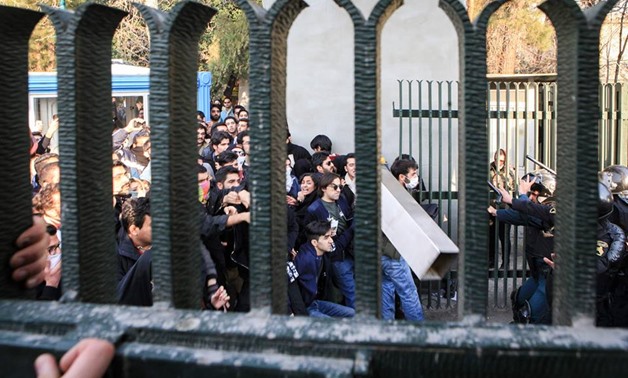 Iranian students scuffle with police at the University of Tehran during a demonstration driven by anger over economic problems, in the capital Tehran on December 30, 2017. Students protested in a third day of demonstrations, videos on social media showed,