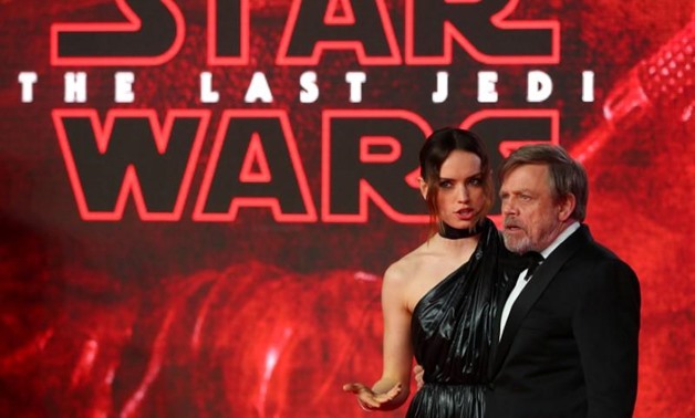 FILE PHOTO: Actors Daisy Ridley and Mark Hamill pose for photographers as they arrive for the European Premiere of 'Star Wars: The Last Jedi', at the Royal Albert Hall in central London, Britain December 12, 2017. REUTERS/Hannah McKay/File Photo