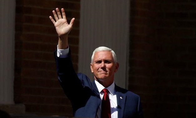 Mike Pence waves at supporters as he arrives at a campaign rally in Scranton, Pennsylvania, U.S., July 27, 2016. REUTERS/Carlo Allegri