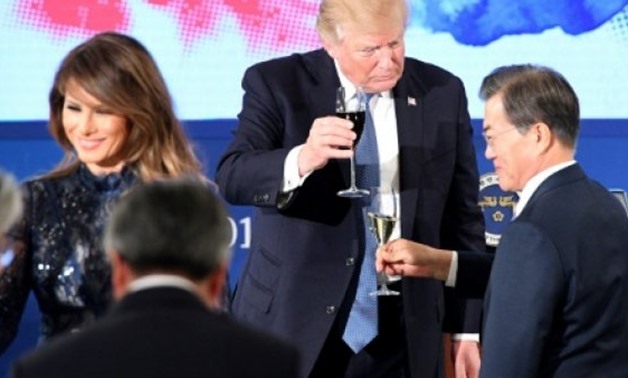AFP/File/by Issam AHMED | US President Donald Trump (C) toasts South Korea's President Moon Jae-In (R) near US First Lady Melania Trump during a state dinner at the presidential Blue House in Seoul on November 7, 2017