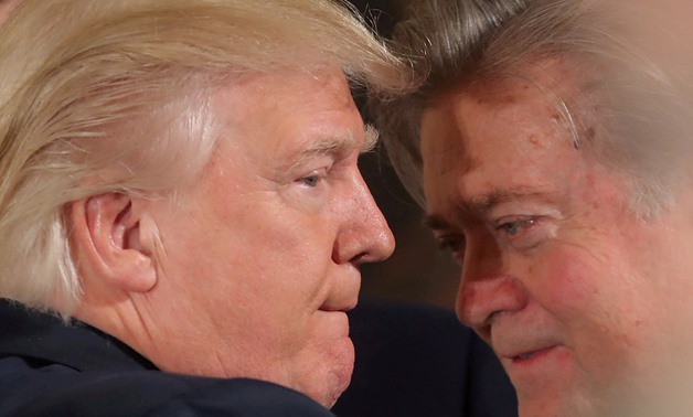 U.S. President Donald Trump talks to chief strategist Steve Bannon during a swearing in ceremony for senior staff at the White House in Washington, U.S. January 22, 2017. REUTERS/Carlos Barria/File Photo